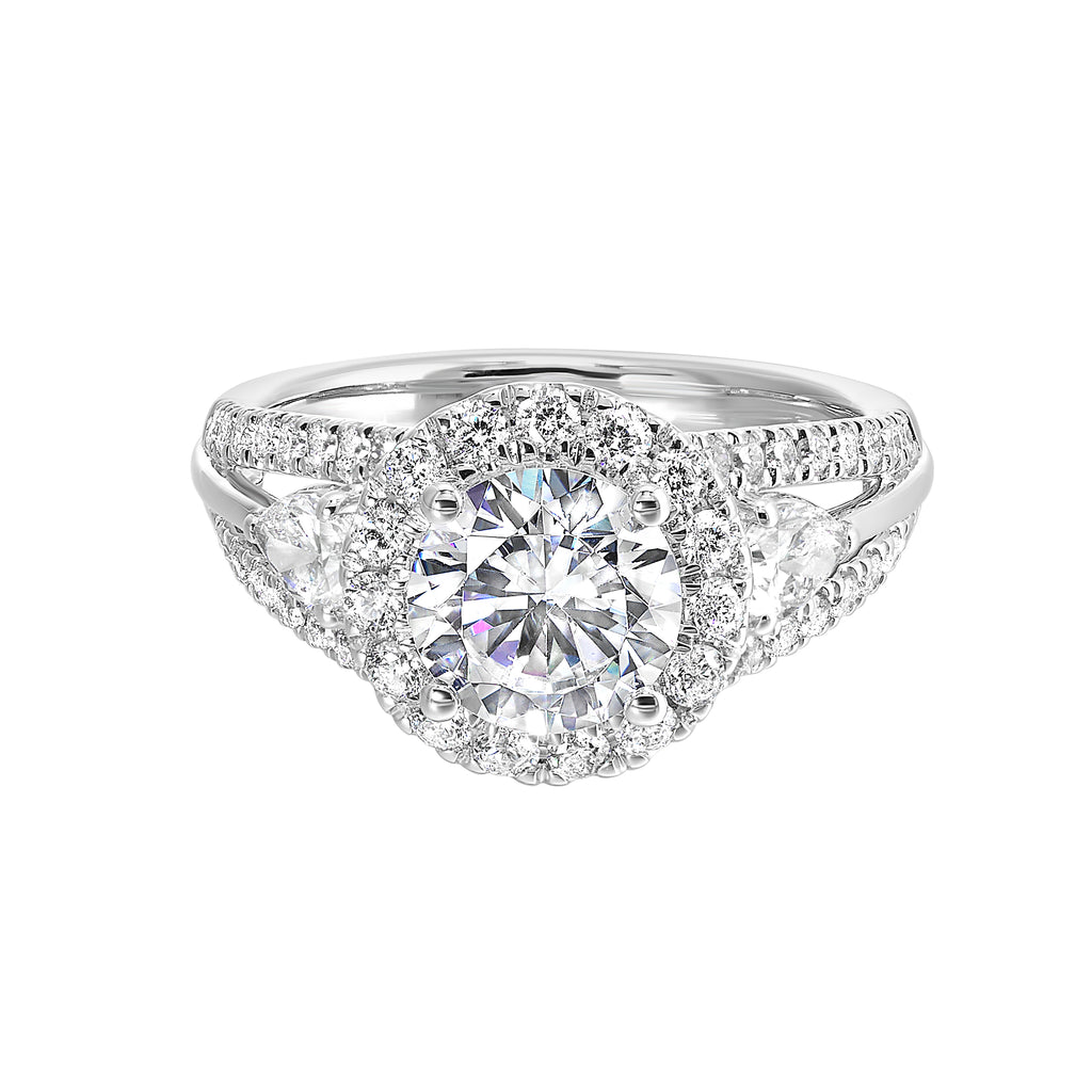 Halo three-stone diamond ring in white gold.