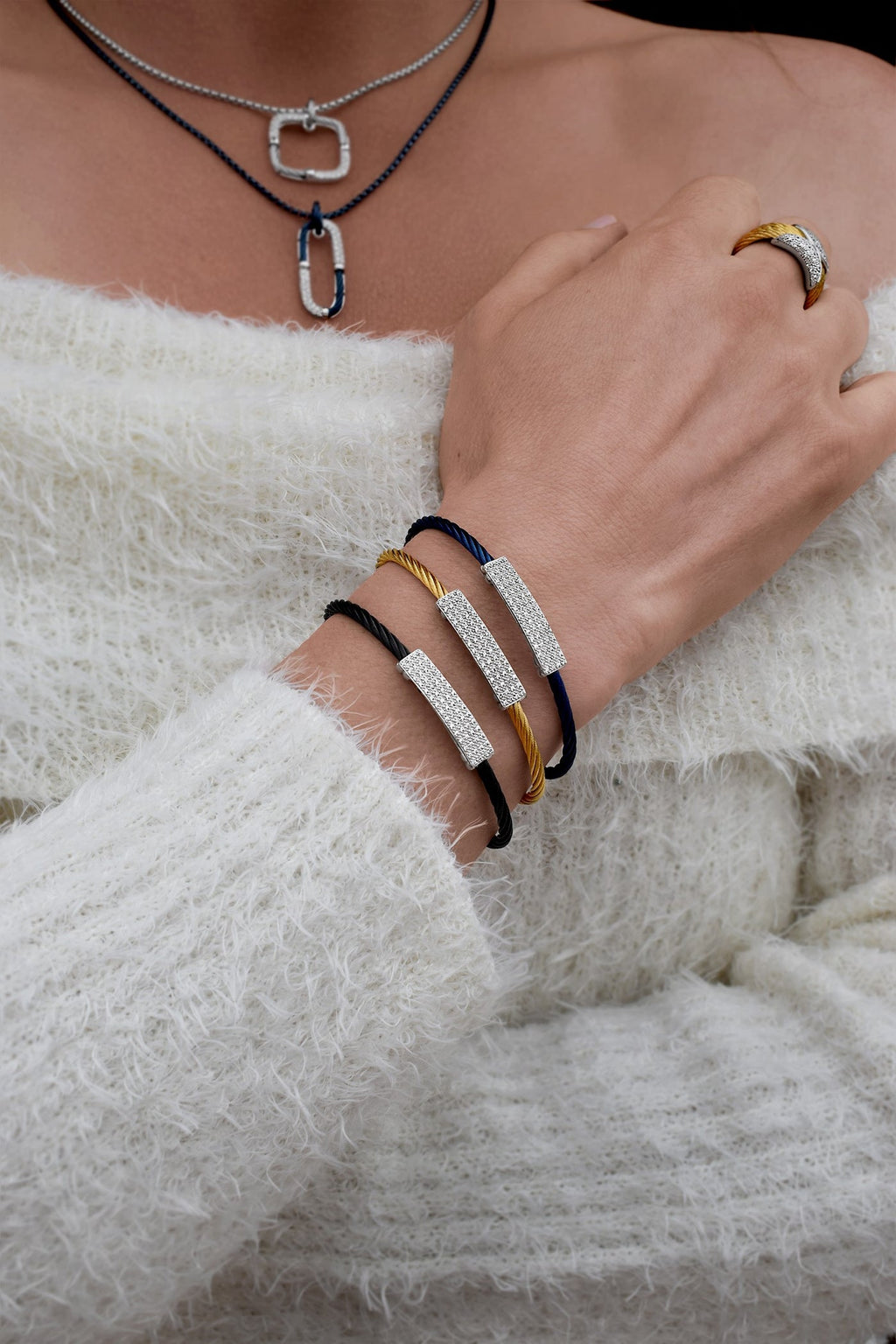 Blue cable bracelet with diamond accents.