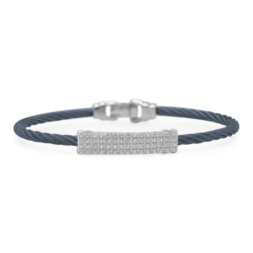 Blue cable bracelet with diamond bar.