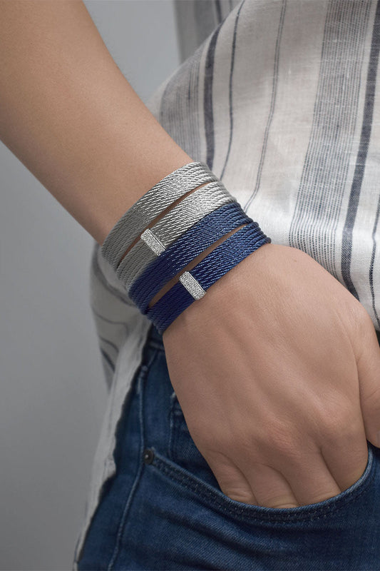 Blue stainless steel cable cuff bracelet.
