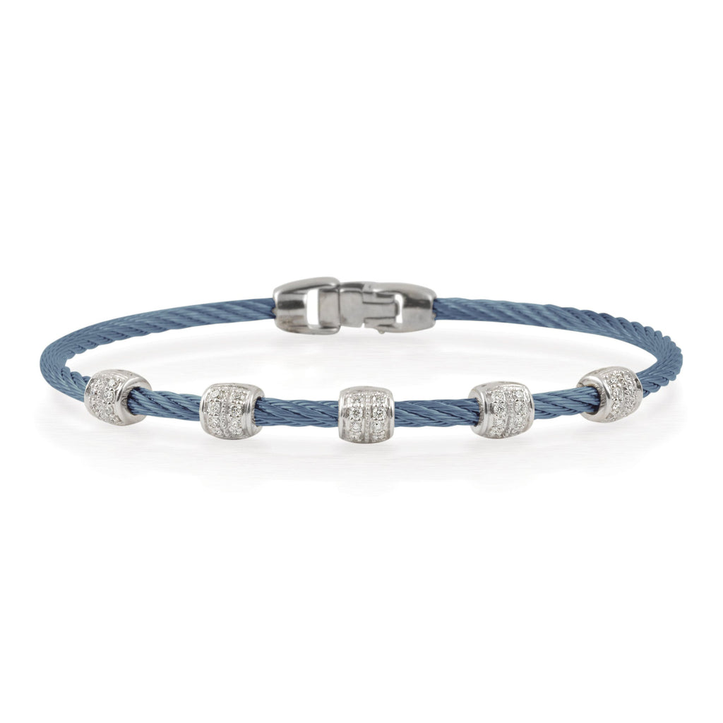 Blue cable bracelet with diamond-studded accents.