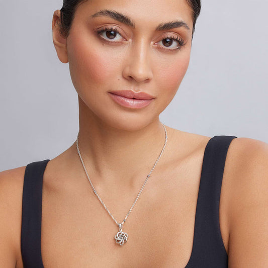 Sterling silver love knot pendant necklace.