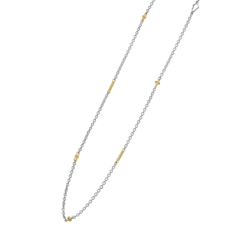 Sterling silver necklace with gold accents.