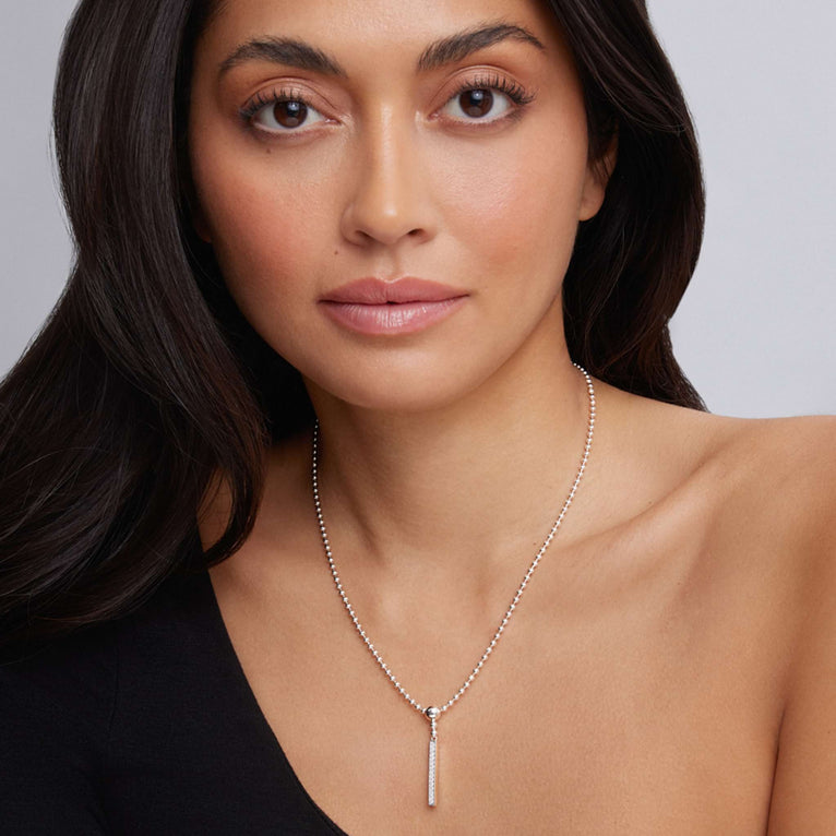 Sterling silver necklace with round diamonds.