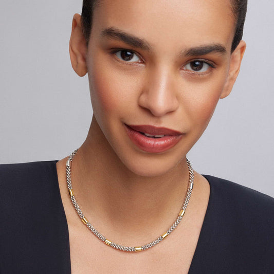 Sterling silver necklace with gold accents.