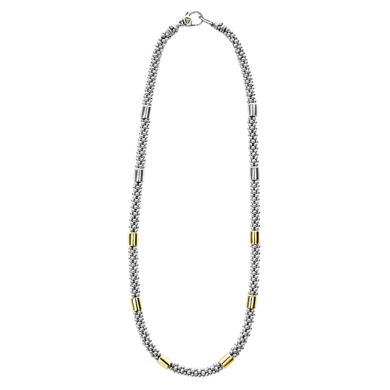 Sterling silver necklace with gold accents.