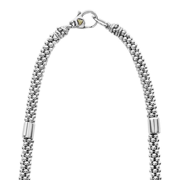 Sterling silver beaded necklace with clasp.