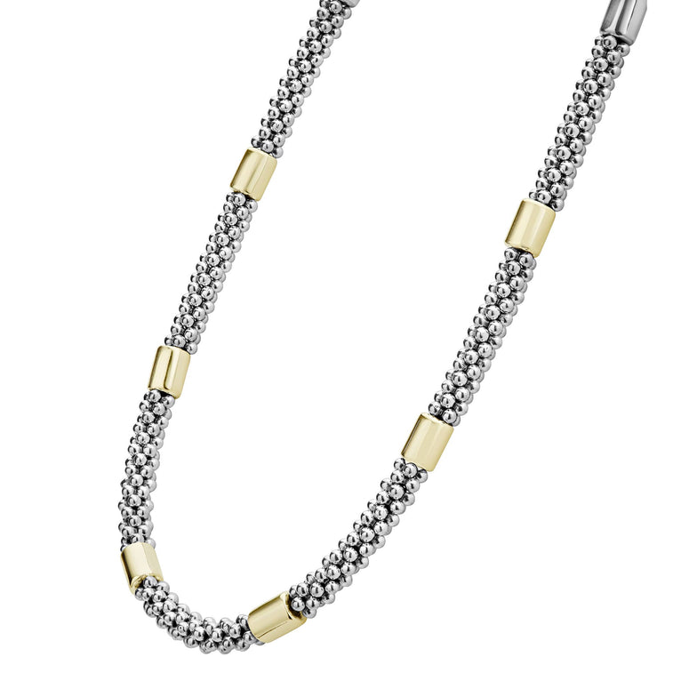 Sterling silver necklace with gold accents.