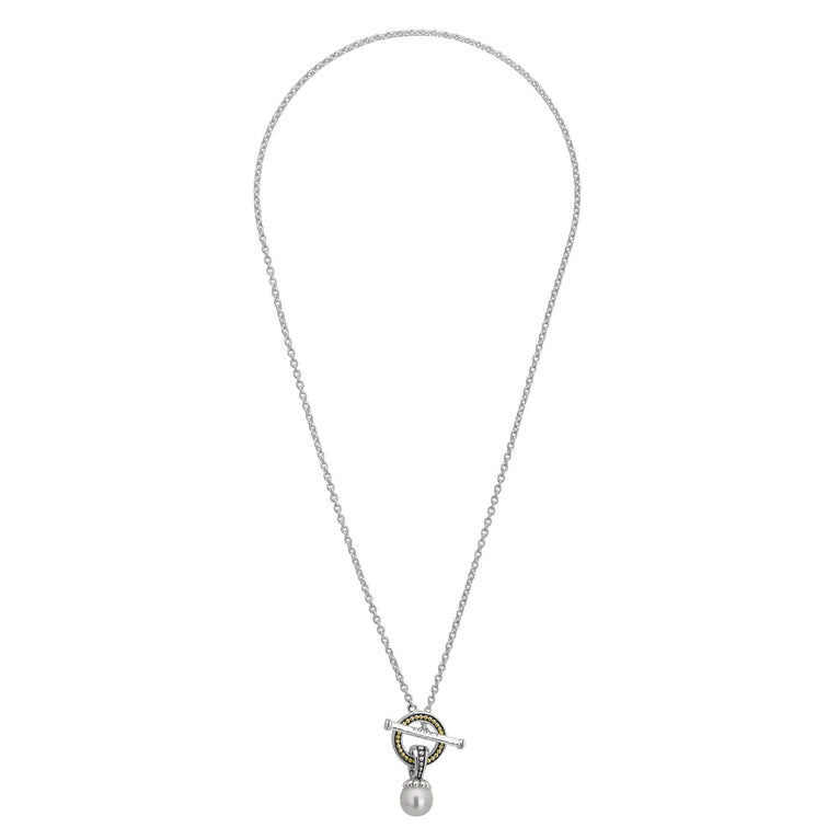 Sterling silver necklace with pearl and gold accents.