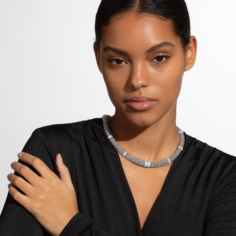 Sterling silver necklace with round diamonds.