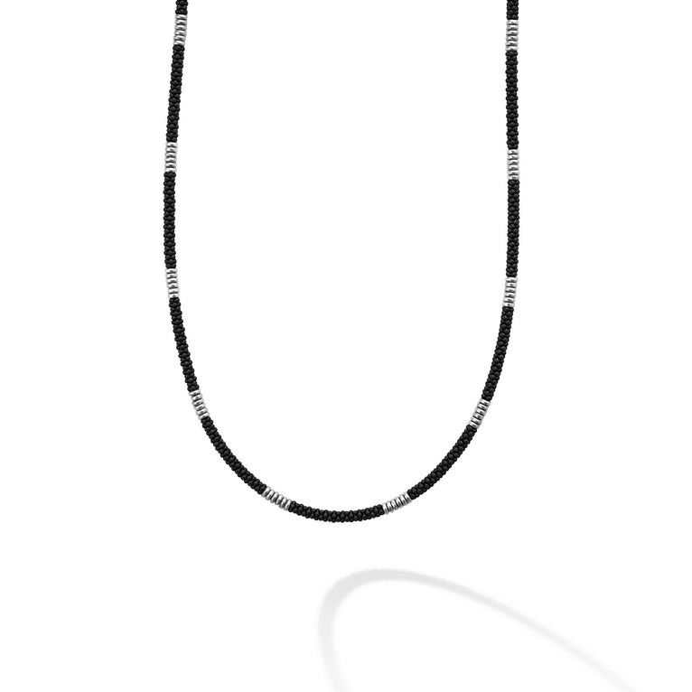 Sterling silver necklace with black ceramic accents.