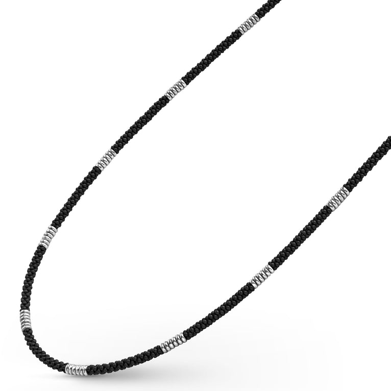 Sterling silver necklace with black ceramic accents.