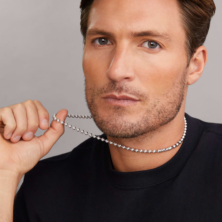 Sterling silver ball chain necklace worn.