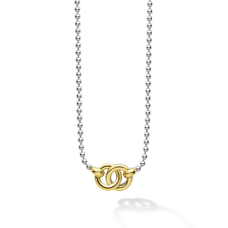 Sterling silver necklace with gold interlocking rings.