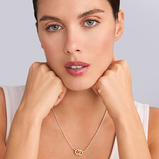 Sterling silver necklace with gold accents.