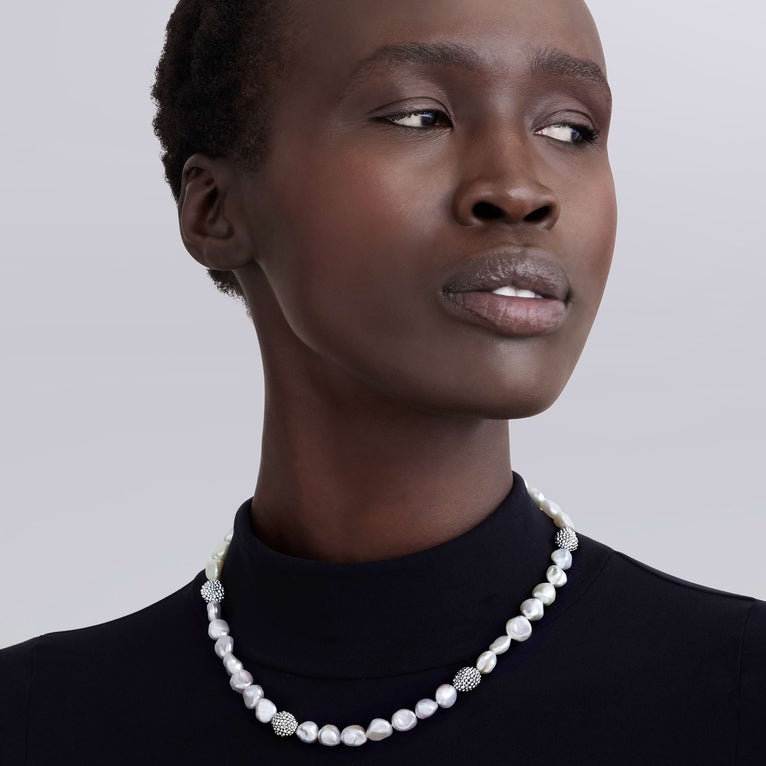Baroque pearl necklace on model.