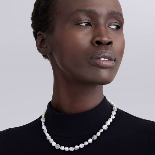 Baroque pearl necklace on model.