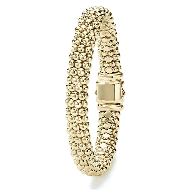 18K yellow gold textured bracelet design.