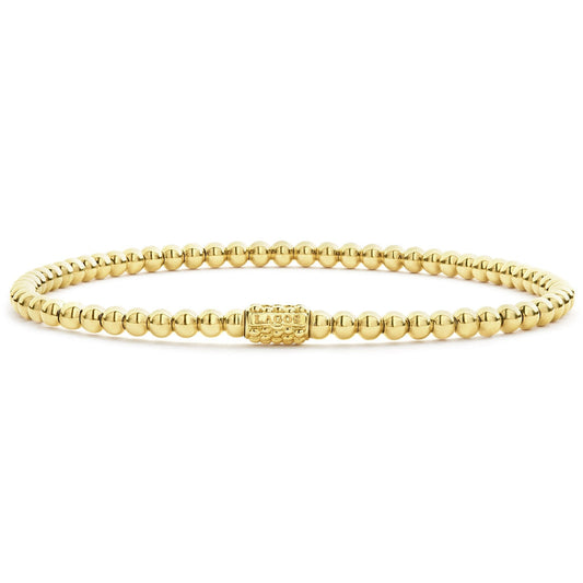18K yellow gold beaded stretch bracelet.