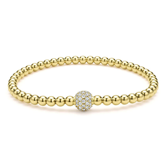 Gold beaded bracelet with diamond centerpiece.