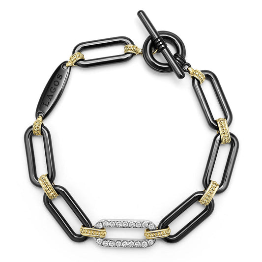 Black ceramic bracelet with yellow diamond accents.
