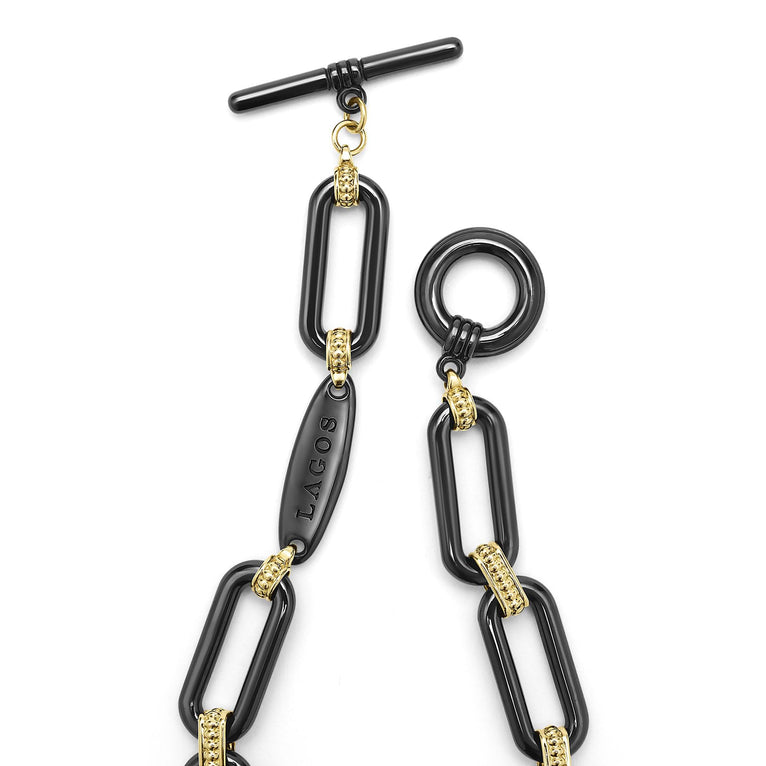 Black ceramic bracelet with yellow gold accents.