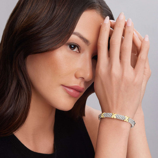 Sterling silver bracelet with gold accents.