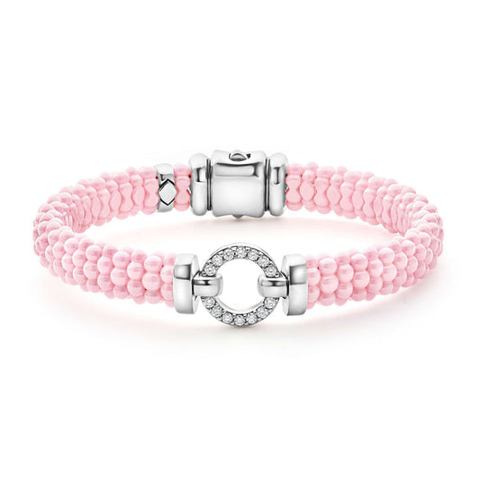 Pink beaded bracelet with diamond circle clasp.