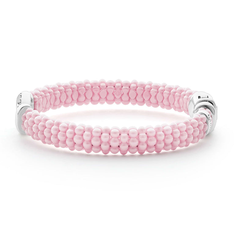 Pink beaded bracelet with diamond accents.