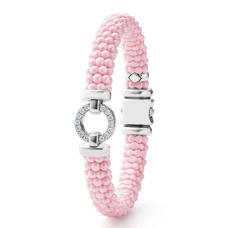 Pink beaded bracelet with diamond accents.