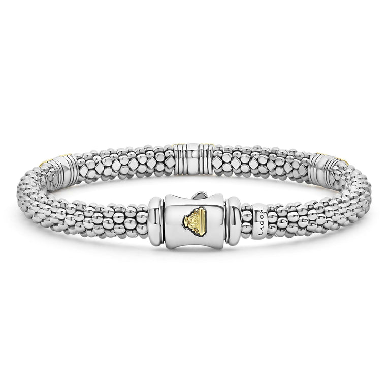 Sterling silver bracelet with gold accents.