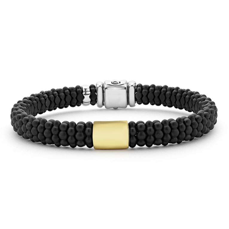 Black beaded bracelet with silver clasp.