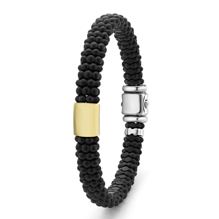 Black beaded bracelet with silver clasp.