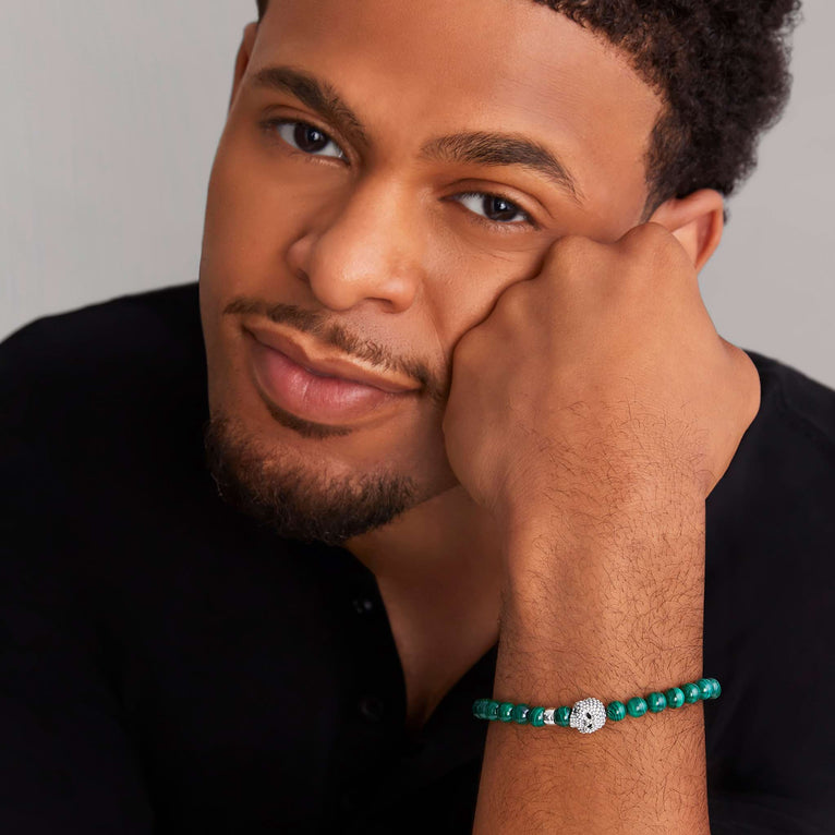 Green malachite bracelet with silver accents.