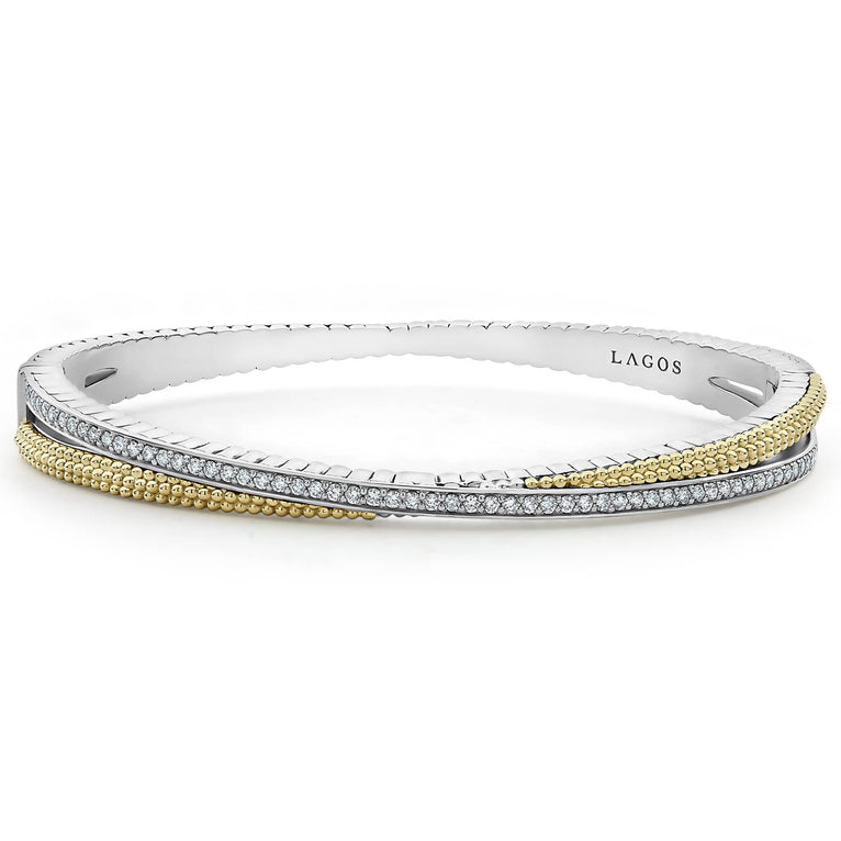 Sterling silver bracelet with diamonds and gold accents.