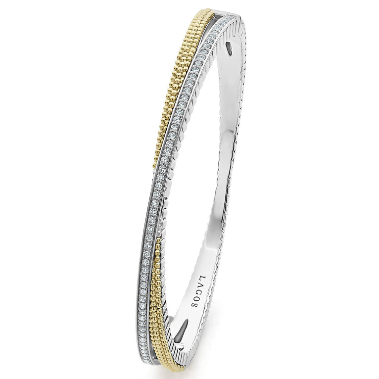 Sterling silver bracelet with diamonds, gold accents.