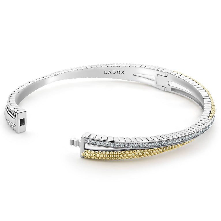 Sterling silver bracelet with diamonds and gold accents.