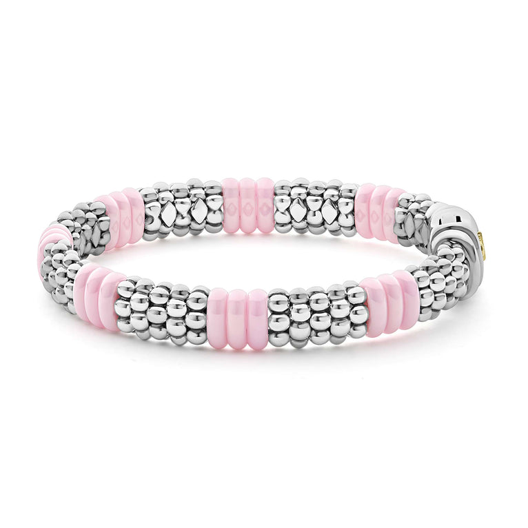 Sterling silver bracelet with pink ceramic accents.