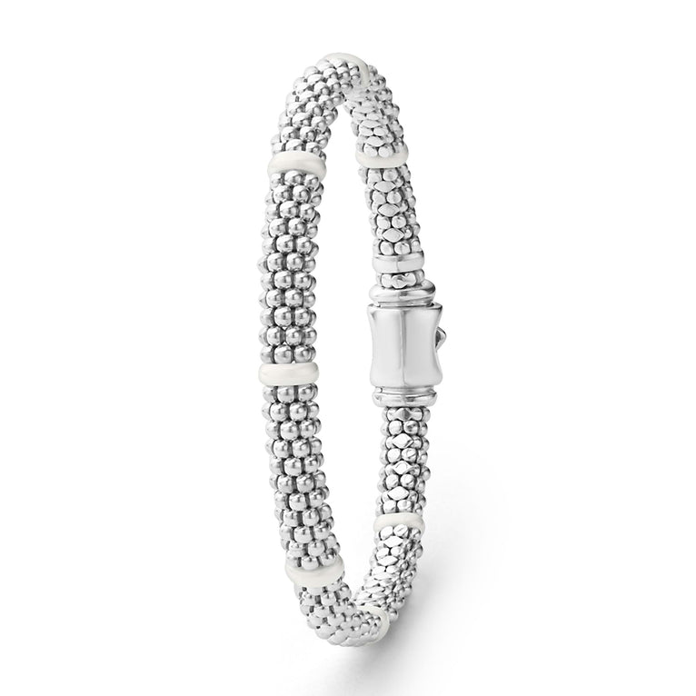 Sterling silver beaded bracelet with white accents.