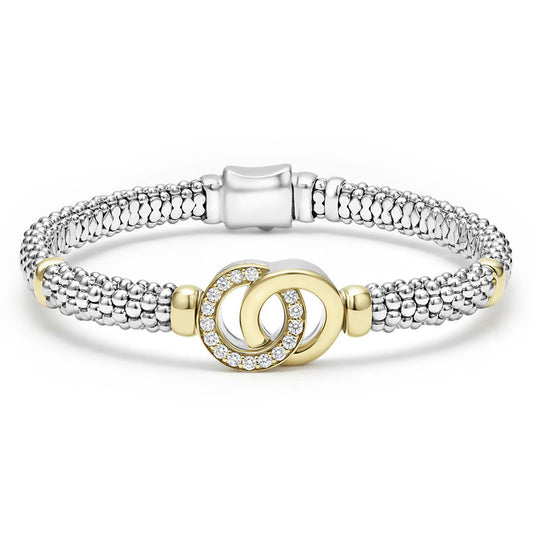 Sterling silver bracelet with gold diamond circles.