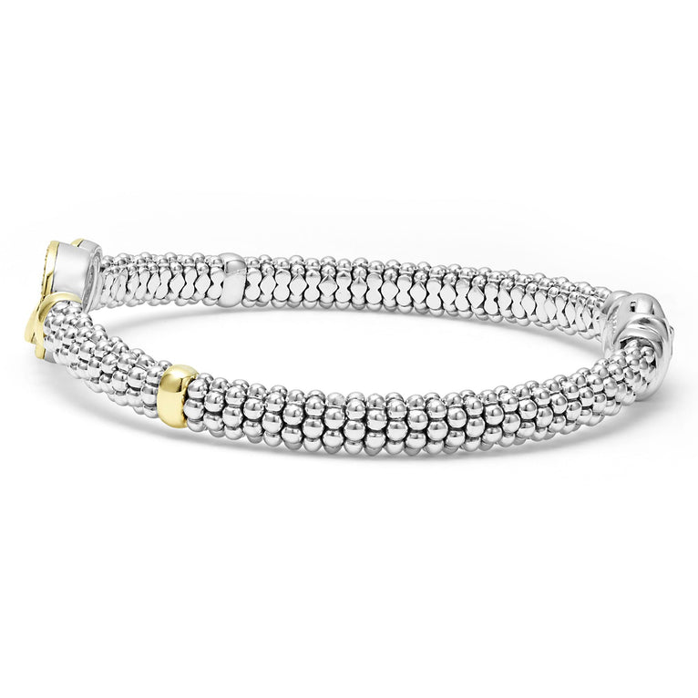 Sterling silver diamond bracelet with two-tone gold accents.