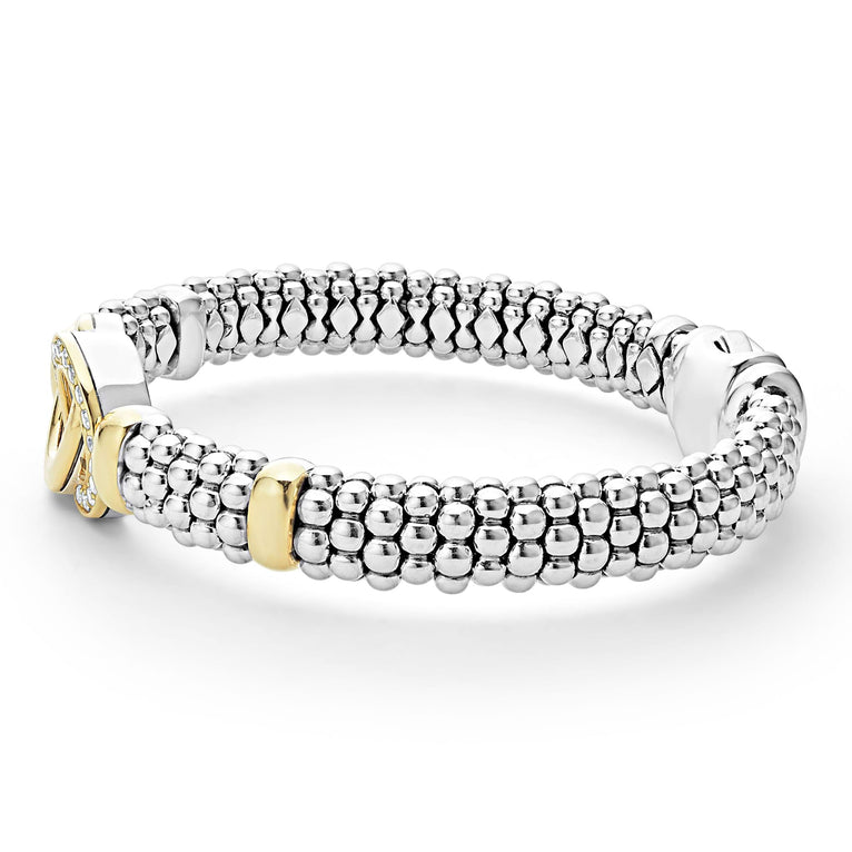 Sterling silver bracelet with gold accents.