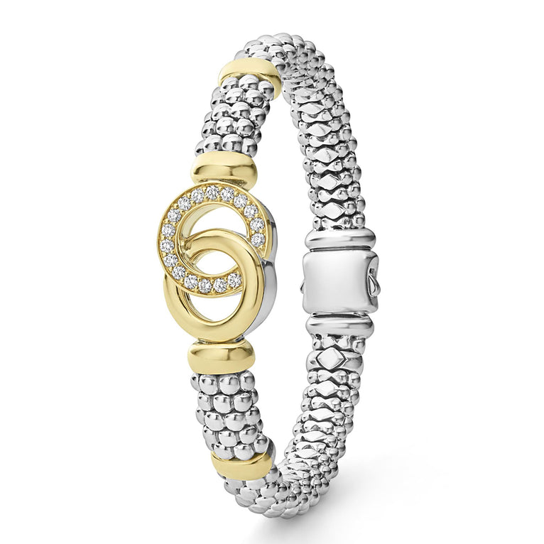 Diamond-accented silver bracelet with gold loops.