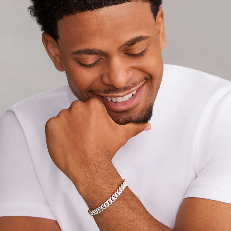 Sterling silver curb link bracelet on wrist.