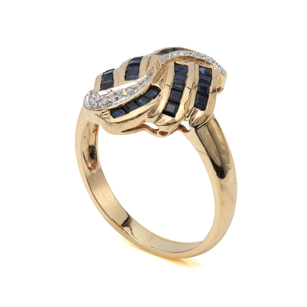 14K gold ring with princess sapphires.