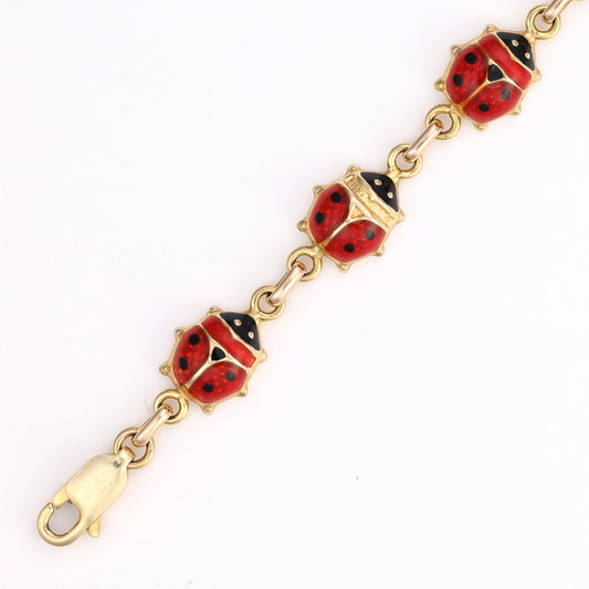 14K gold bracelet with red-black ladybug links.