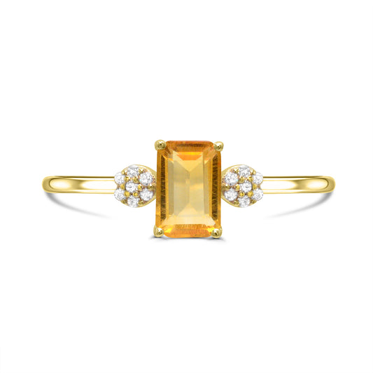Emerald citrine ring with diamonds in gold.