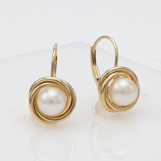 14K gold earrings with white Mabe' pearls.