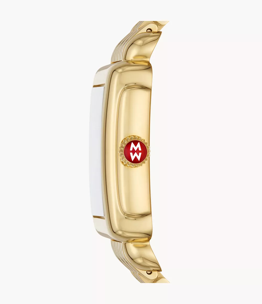 Gold-plated watch side view with red crown.