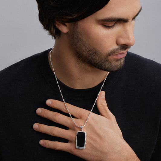 Sterling silver rectangular pendant necklace.